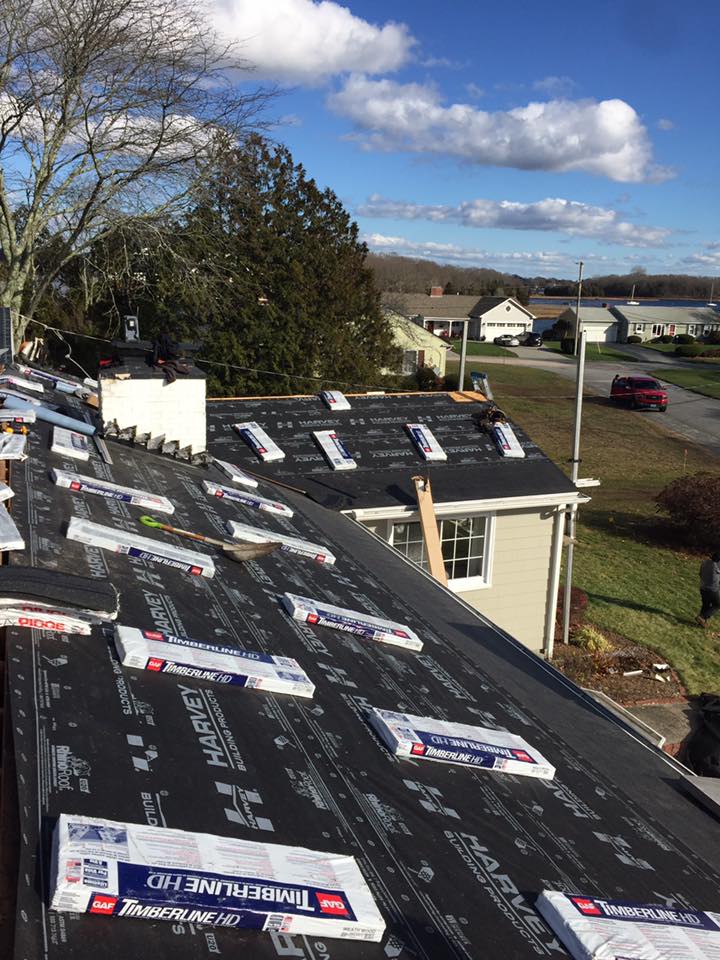 Expert Roofing contractor preparing to replace an old residential roof